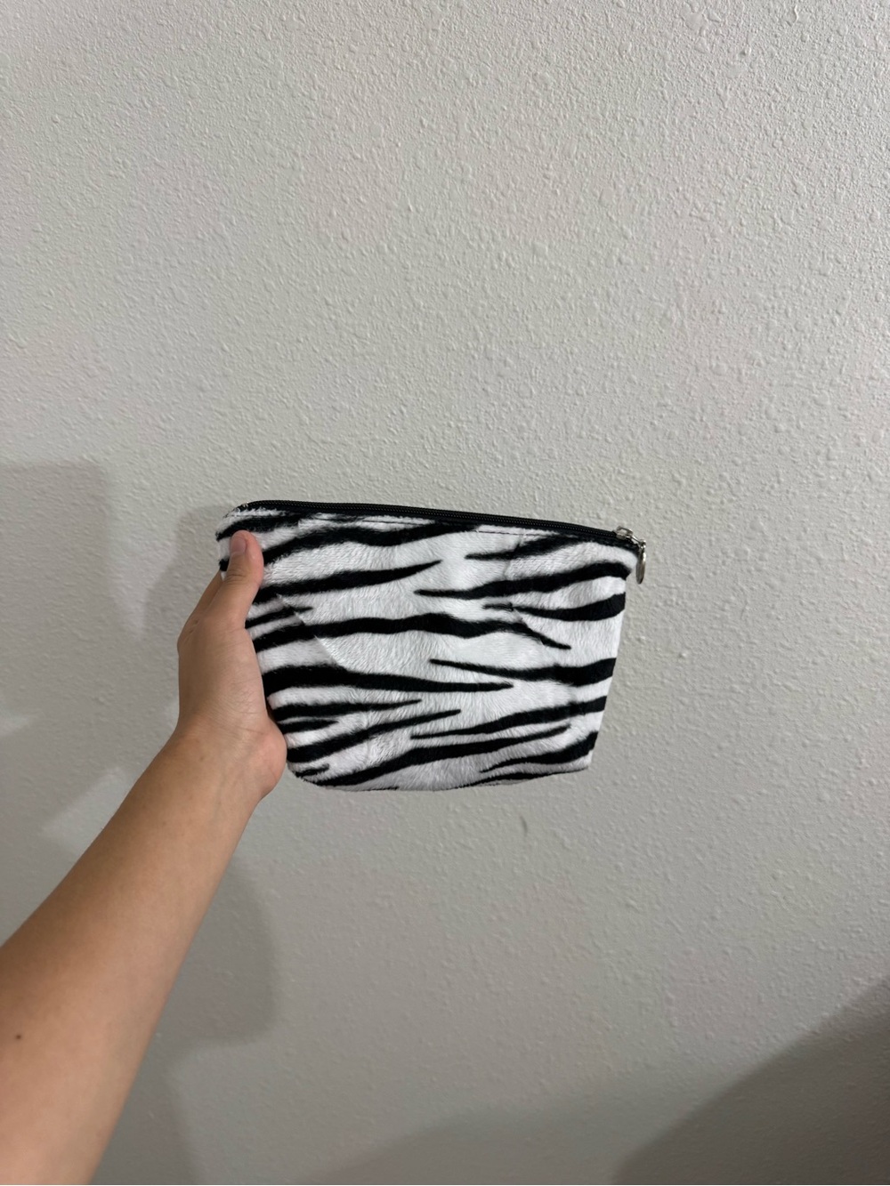 Small zebra print pouch bag